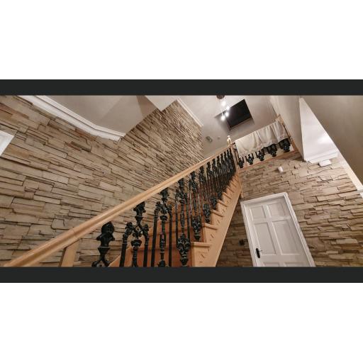 A view of Vintage Ledgestone Mojave 19 on a interior stairs wall